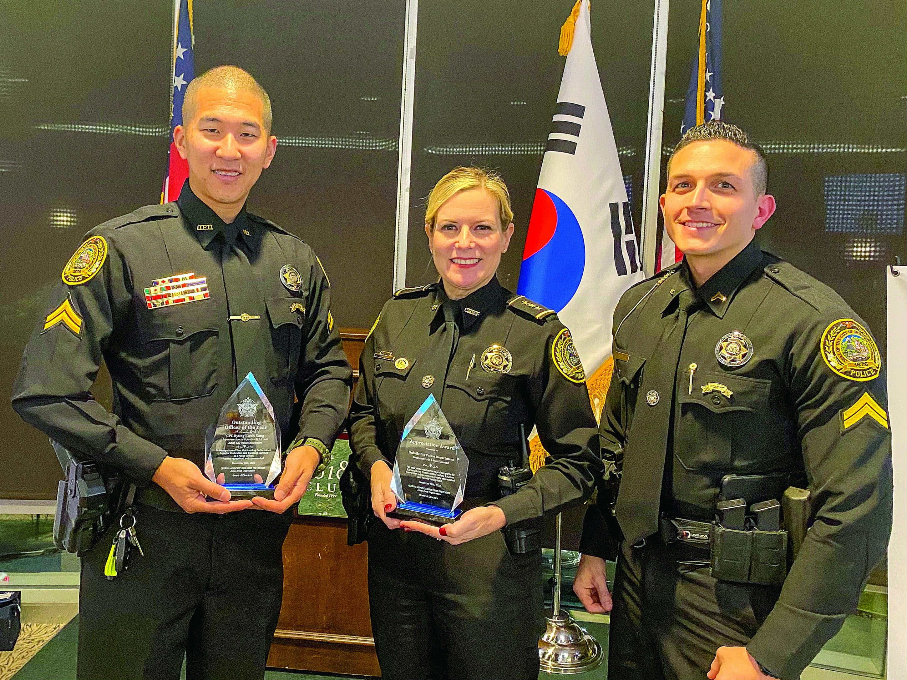 Corporal Byung Kang, Chief Jacquelyn Carruth and Corporal Ted Sadowski receive the awards from Georgia Advocates for Crime Prevention in December.