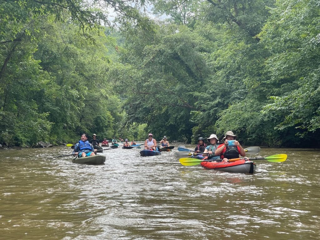 People in kayaks on a river
