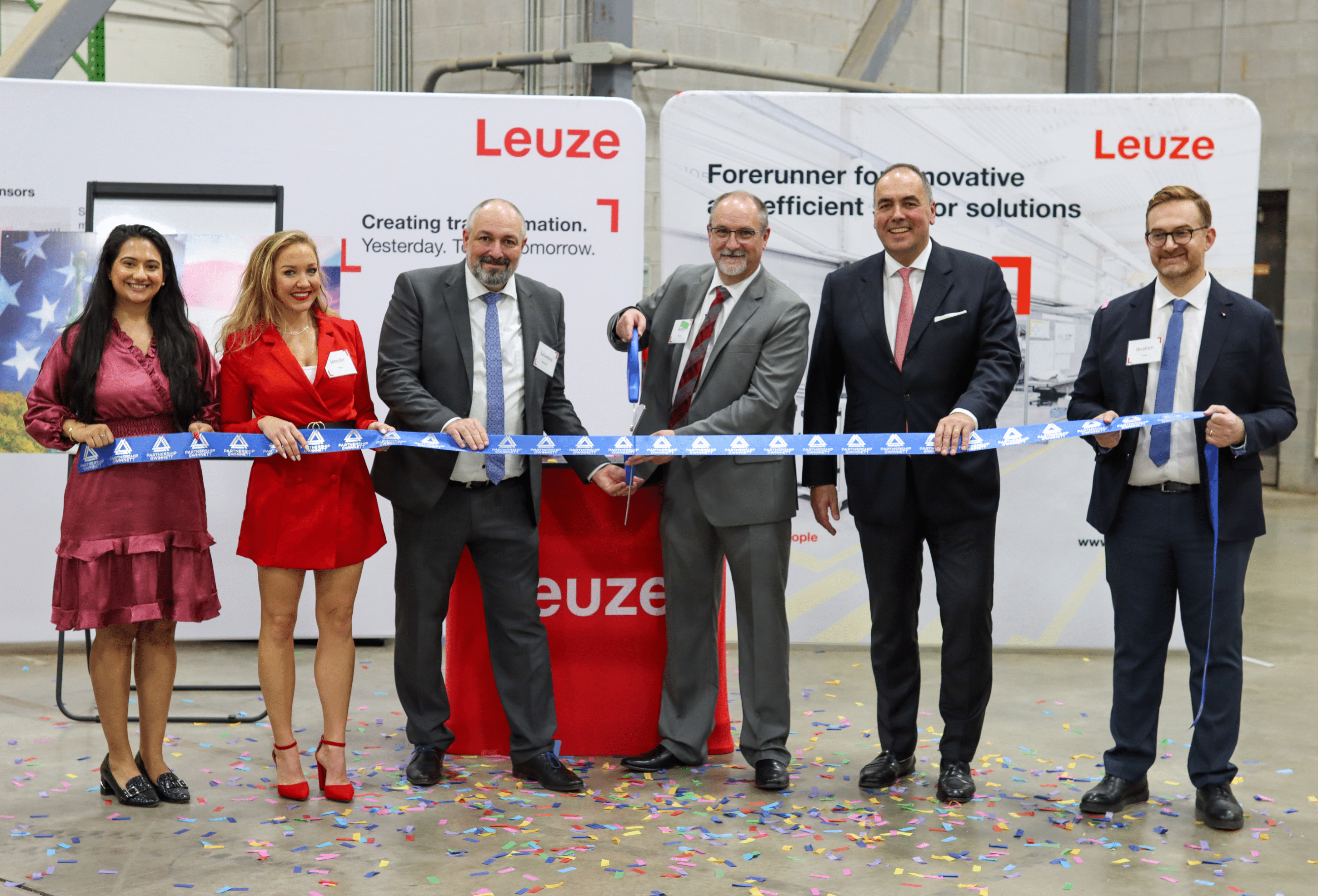 Photo Caption: Leuze electronics, Inc. executives joined Partnership Gwinnett and the Gwinnett Chamber to cut the ribbon for their new operations.