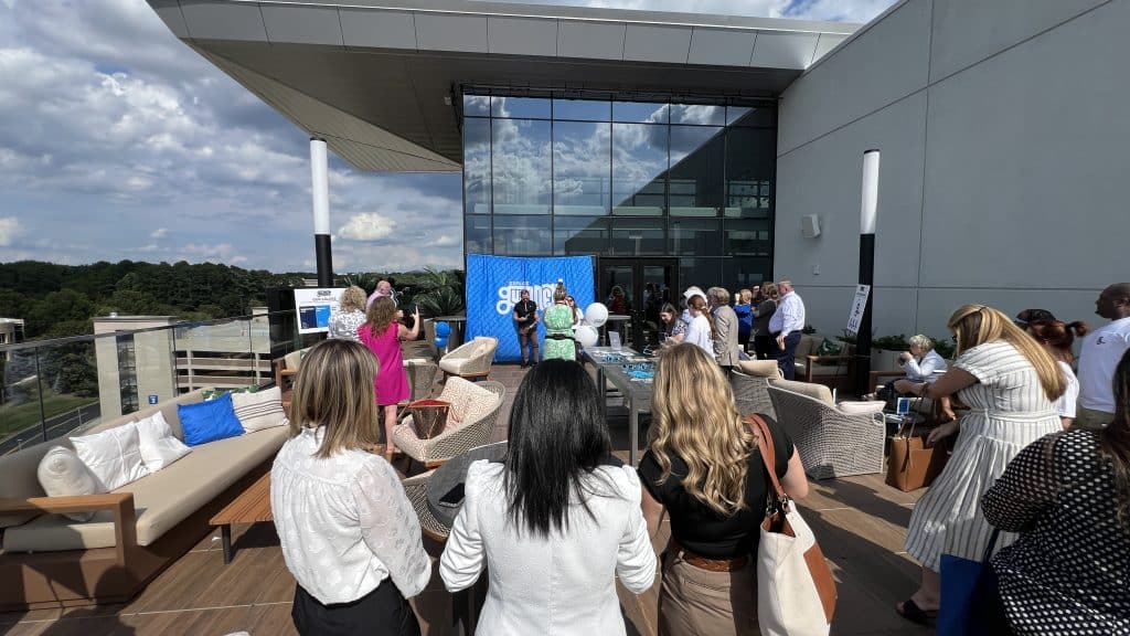 Small group of people gathered for a rooftop event