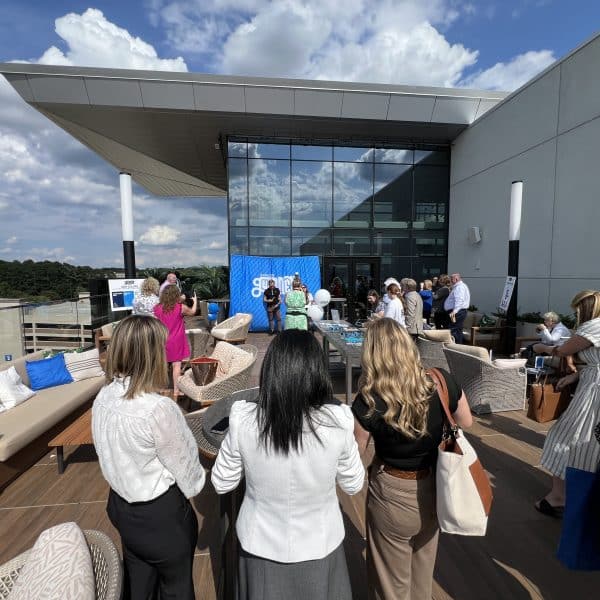 Small group of people gathered for a rooftop event