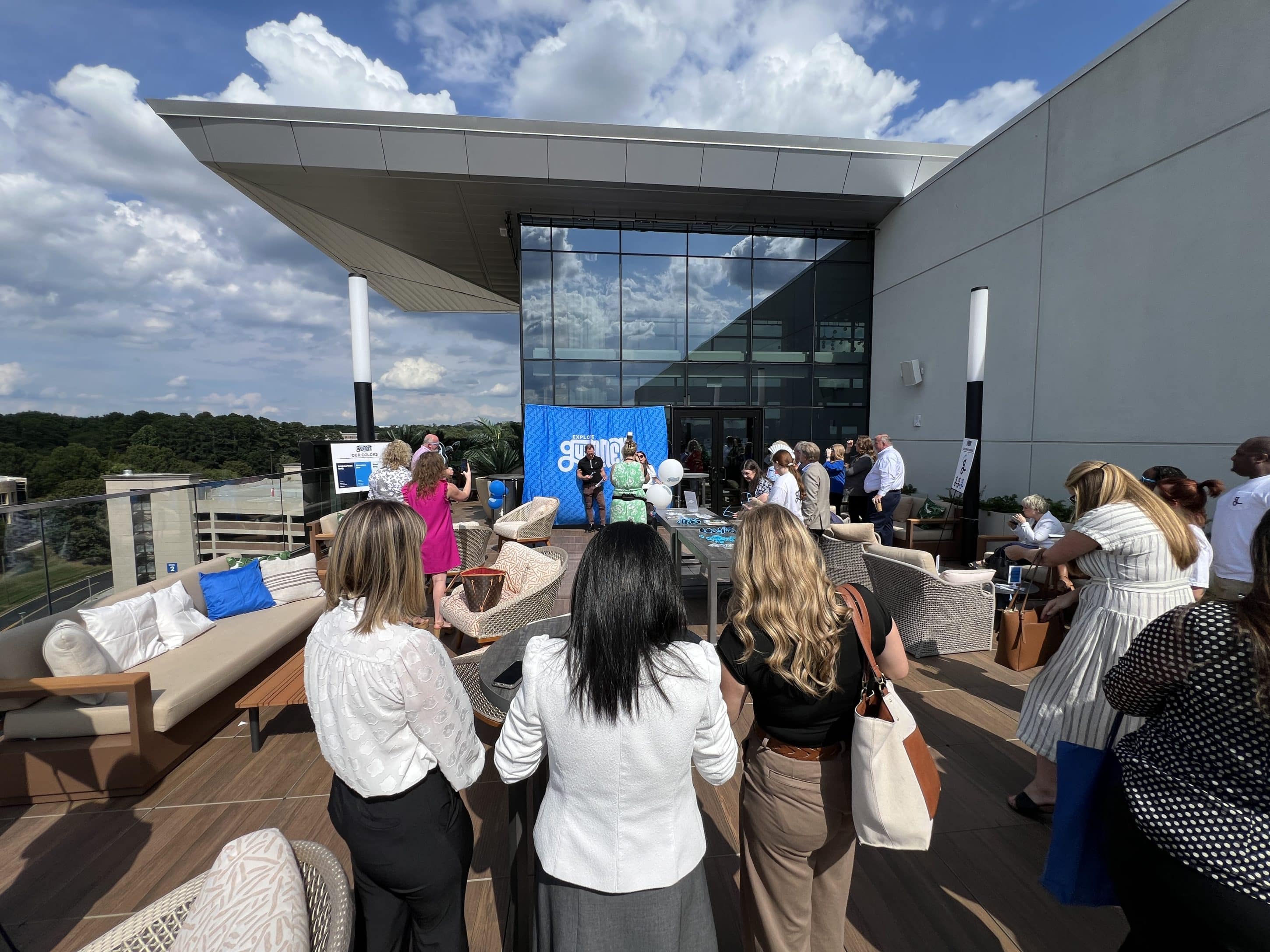 Small group of people gathered for a rooftop event