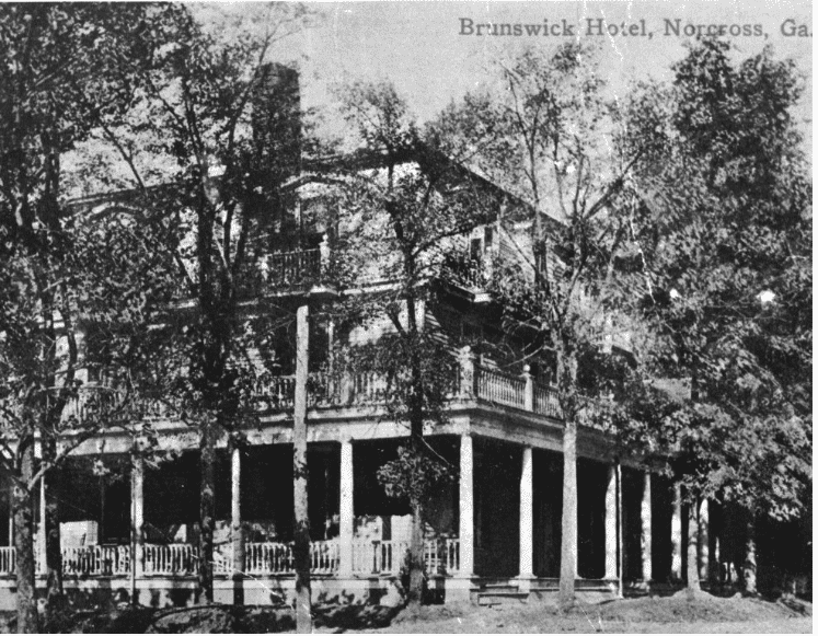 Black and white image of the historic Brunswick hotel in downtown Norcross