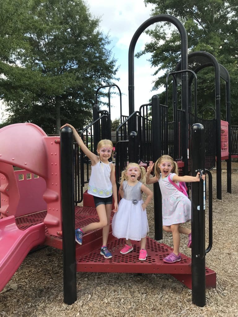 Three young girls on a playground