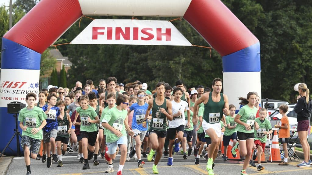 Group of runners participating in a 5k race