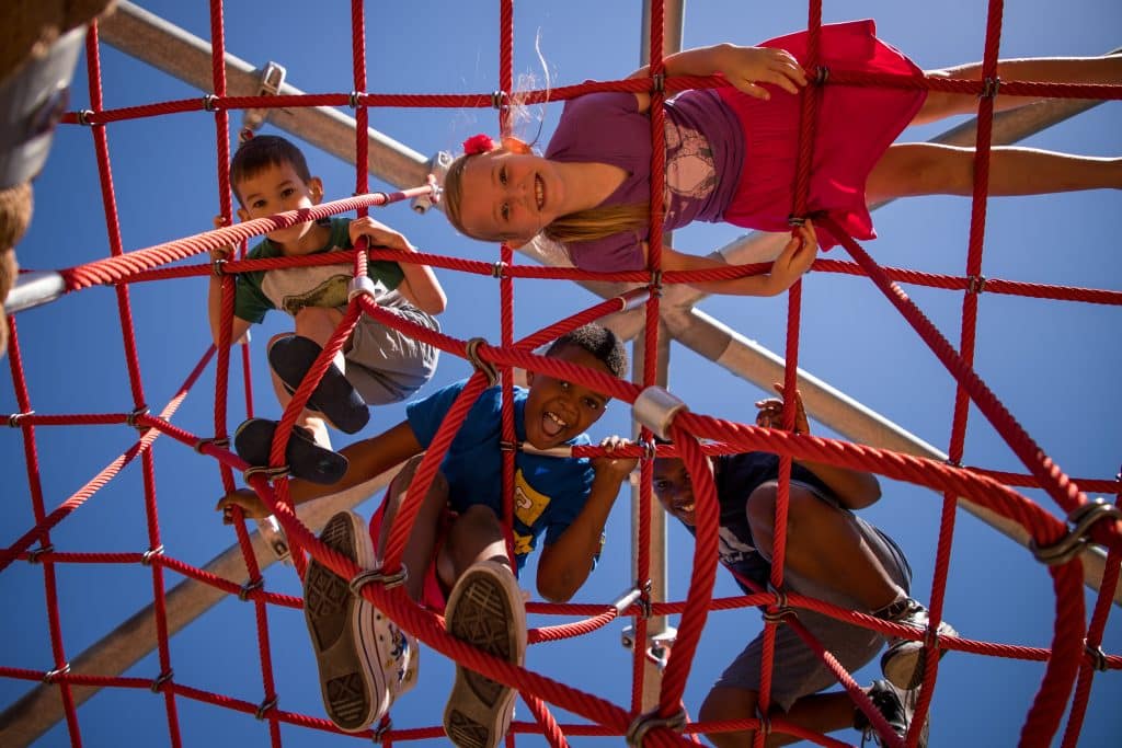 kids on top of playground equipment