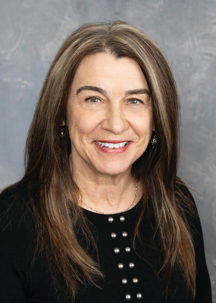 headshot of a woman with long brown hair