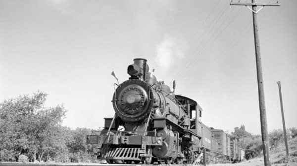 black and white photo of an old shortline train