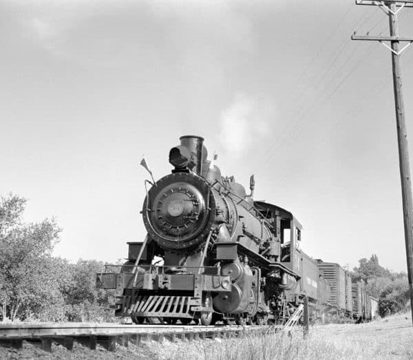 black and white photo of an old shortline train