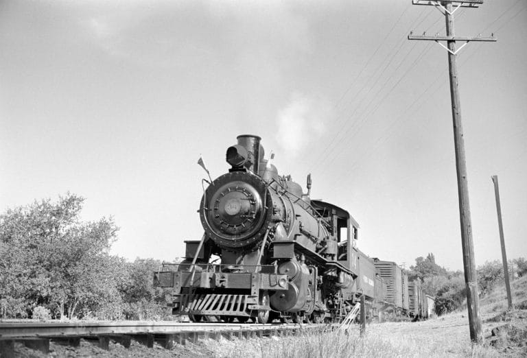 black and white photo of an old shortline train