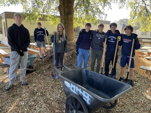 people volunteering for a community cleanup day