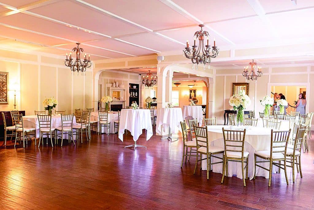 Indoor ballroom/dining room in historic venue, set up for a private event