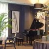 fancy private event space with tables and a piano