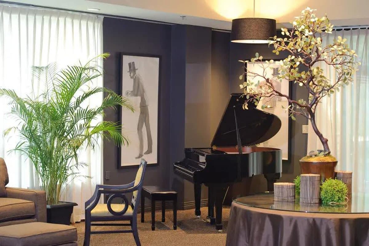 fancy private event space with tables and a piano