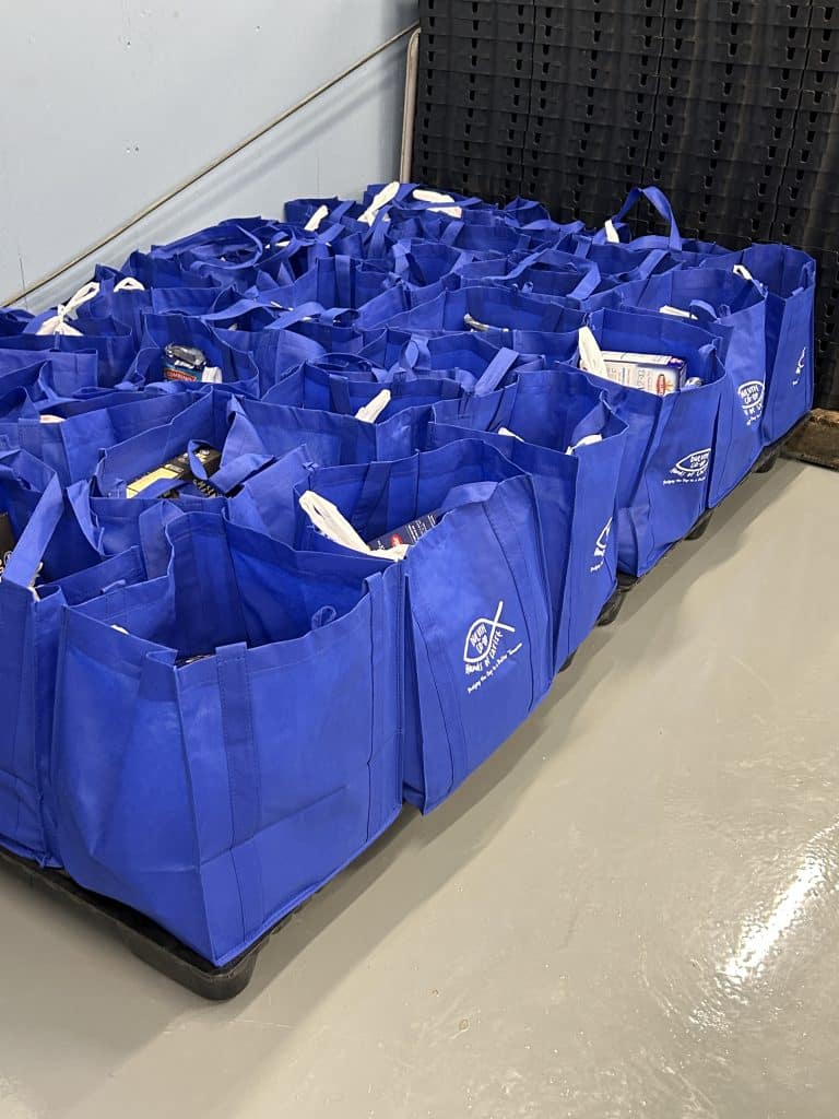 Bags of food items lined up at the Duluth Co-op food pantry