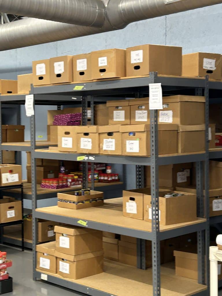 Well-organized and labeled shelves at a local food pantry co-op