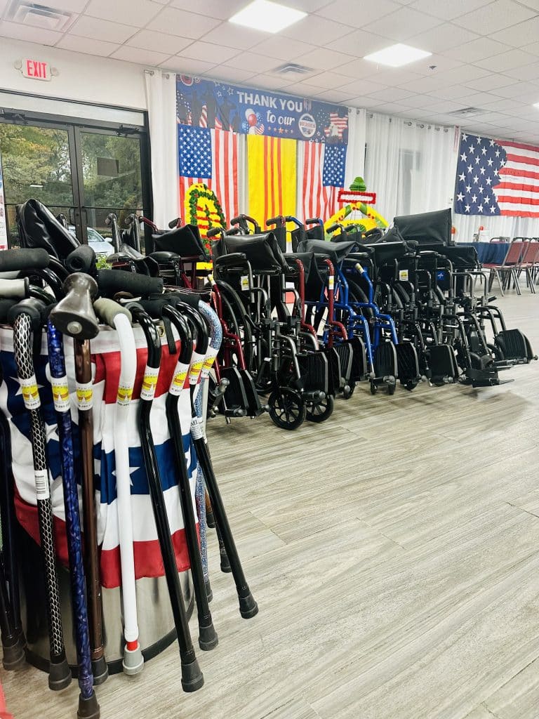 donations of wheelchairs and canes at a Veterans Day ceremony