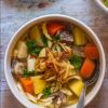 bowls of chicken and vegetable soup