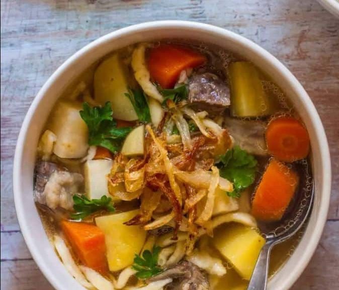 bowls of chicken and vegetable soup