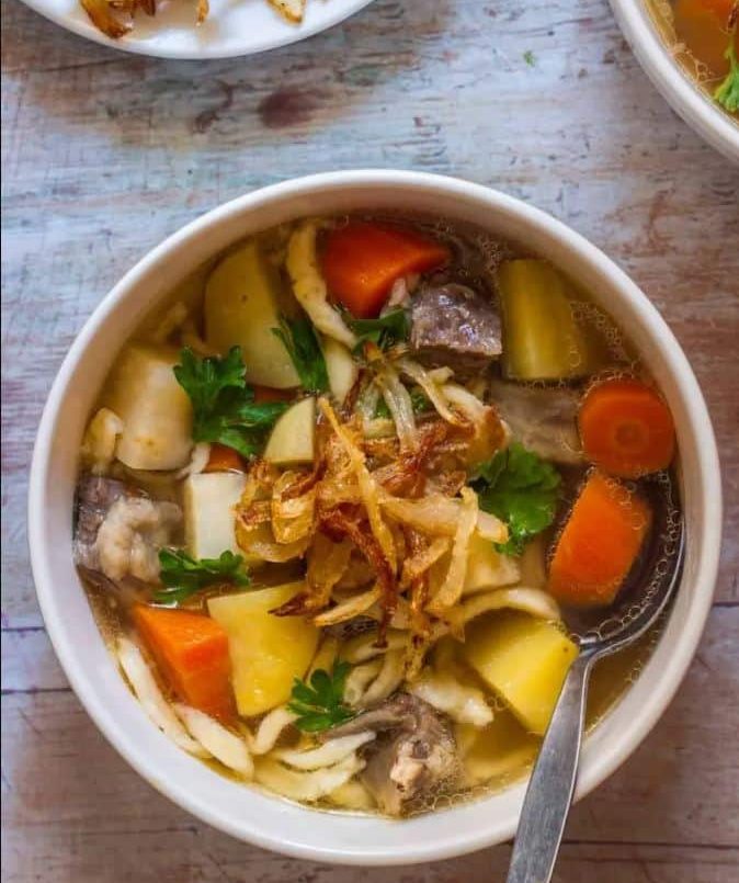 bowls of chicken and vegetable soup