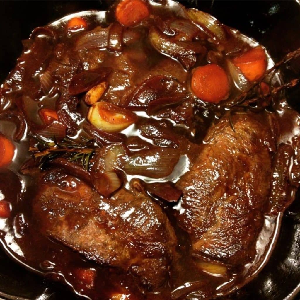 A pot of braised short ribs with dark brown sauce