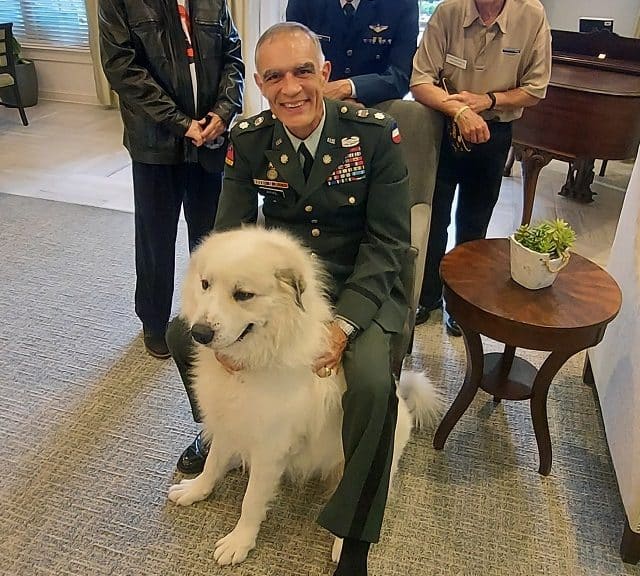 US Military veteran with his dog at an event