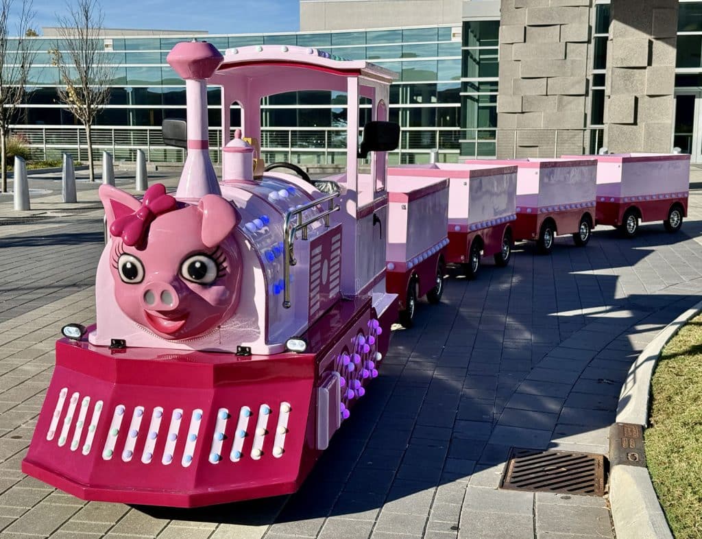 Front view of Penny the Pink Pig train at Georgia Festival of Trees