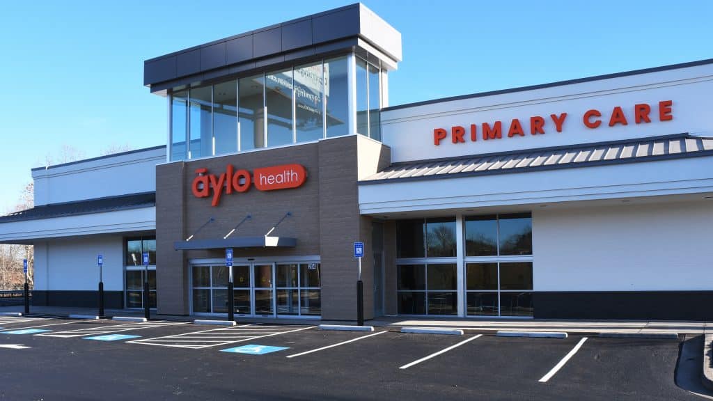 Exterior shot of an Aylo Healthcare Center and empty parking lot.