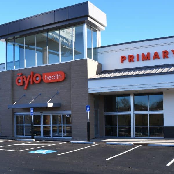 Exterior shot of an Aylo Healthcare Center and empty parking lot.