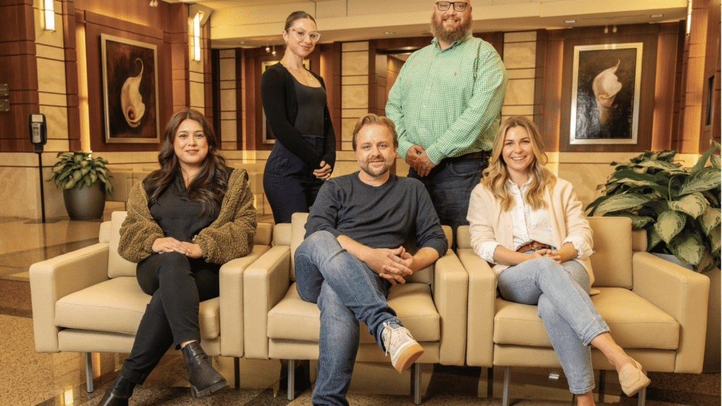 Lawyers and staff from a metro Atlanta lawfirm in the reception area of their office