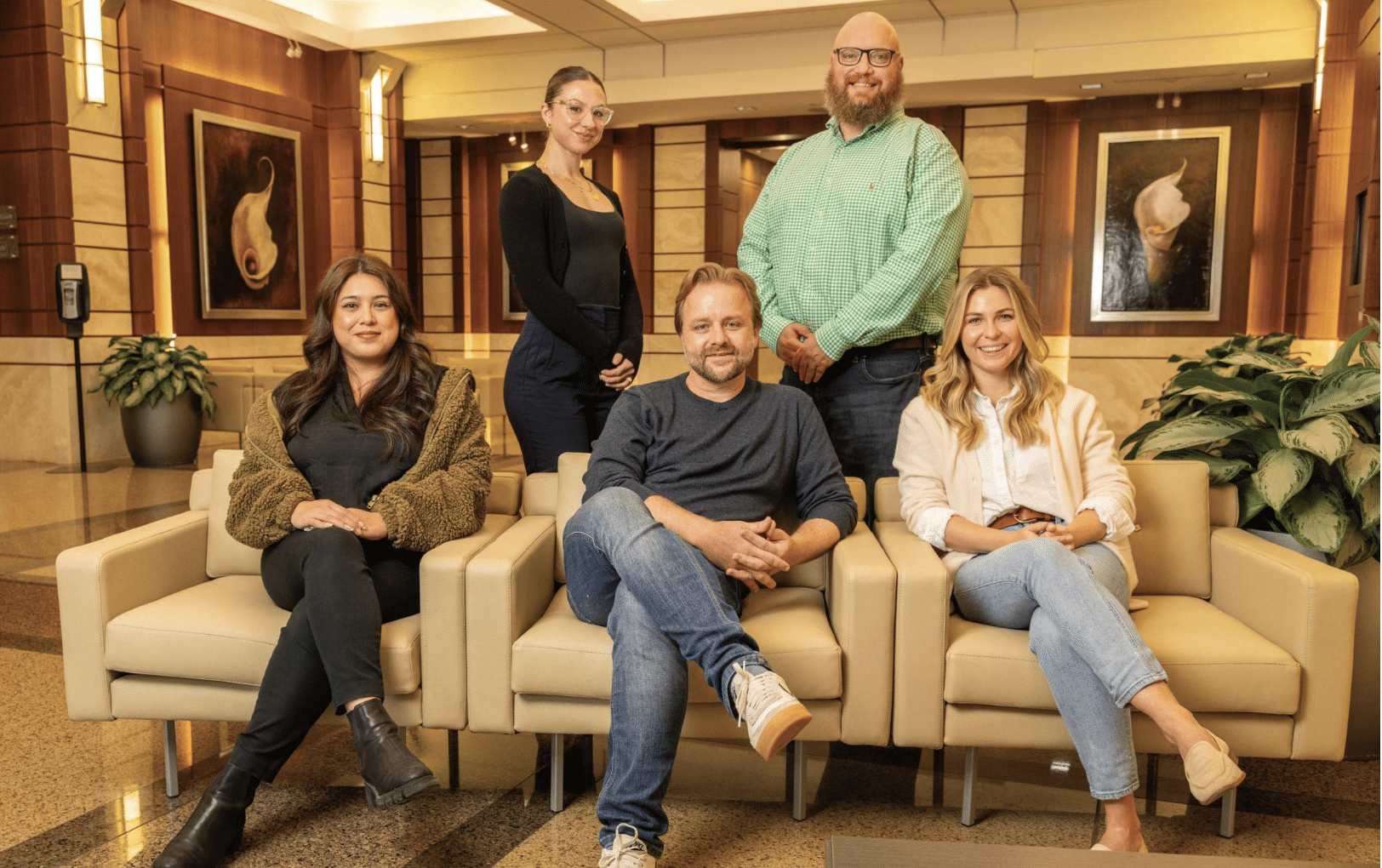 Lawyers and staff from a metro Atlanta lawfirm in the reception area of their office