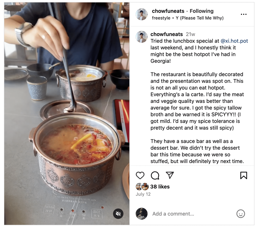 Instagram post of a hot pot meal with two small bowls of hot stew and small side dishes on a grey tabletop. A person wearing a black top reaches towards one of the hot pot bowls with chopsticks.