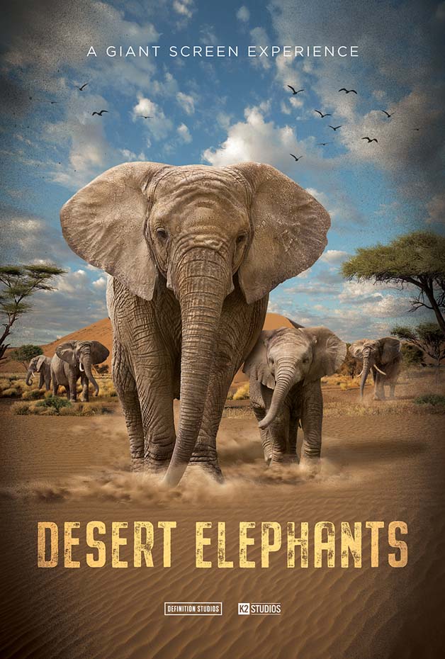 Poster for the Desert Elephants IMAX film, showing a large elephant with an elephant calf with desert landscape, scrubby trees and blue sky overhead