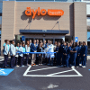 Group of people in a parking lot at a ribbon cutting for Aylo Health in Suwanee, GA.