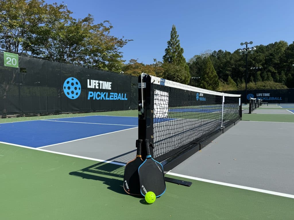 Pickleball court and net with Life Time signage in background