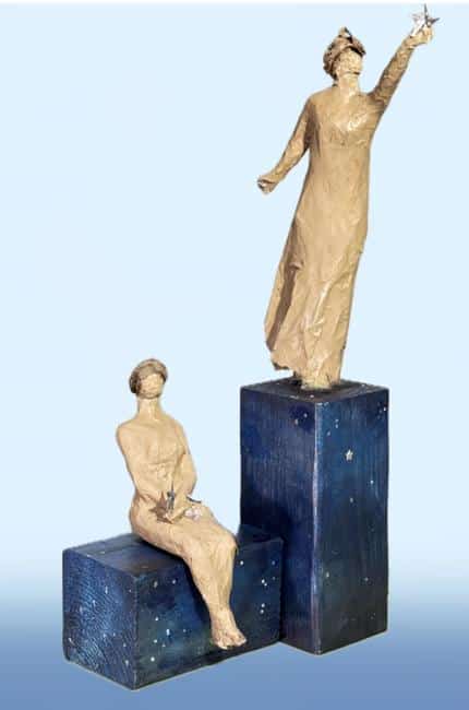 Two small sculptures titled "The Dreamers" by Anne Labaire