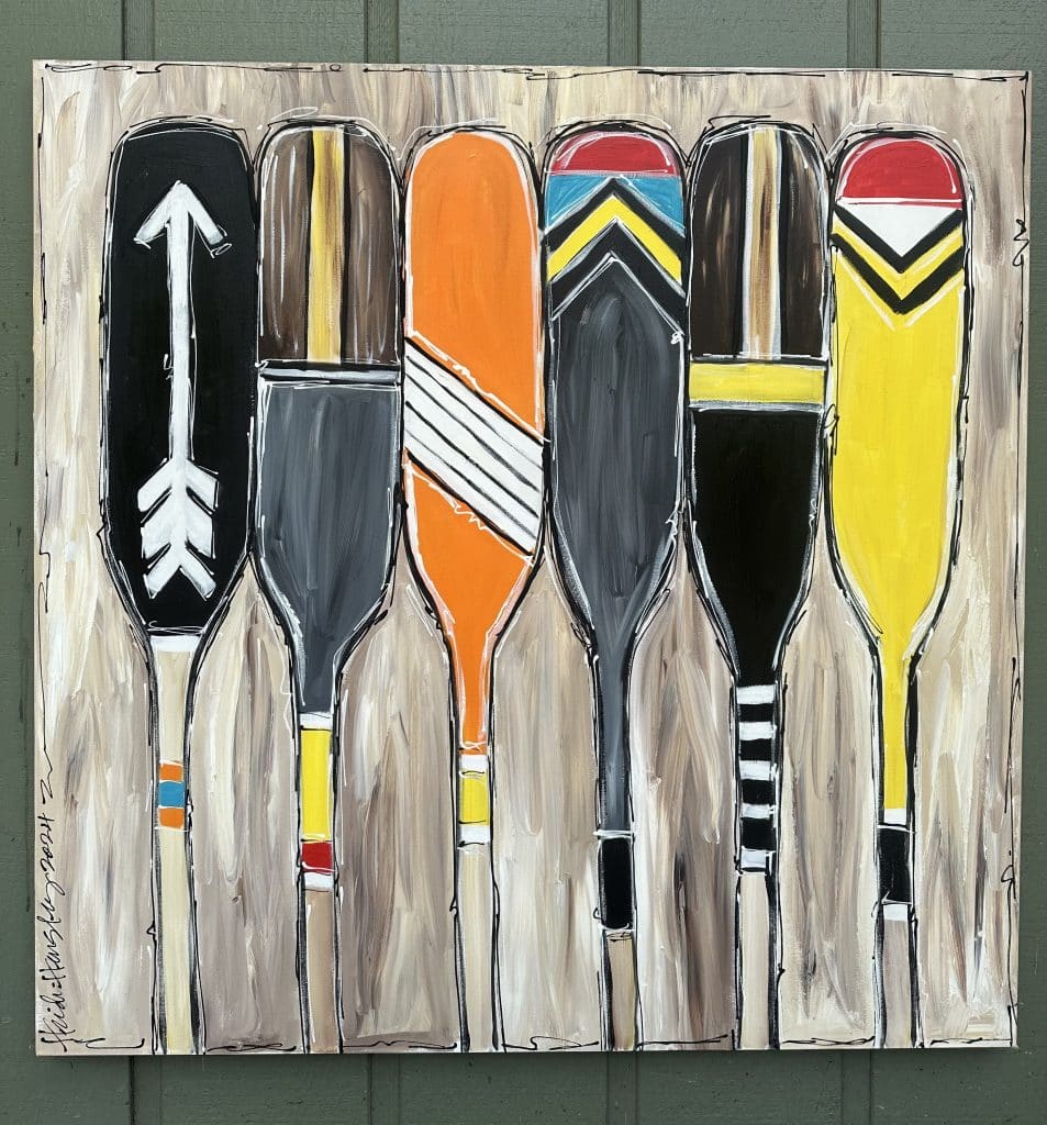 Colorful painting of oars for a lake house commissioned by artist Heidi Hensley