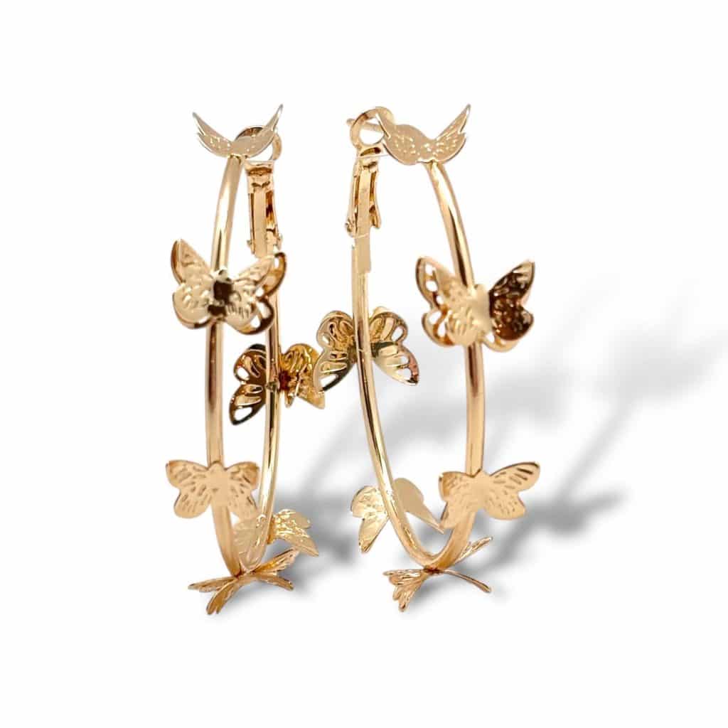 Gold butterfly hoop earrings by Shiver + Duke