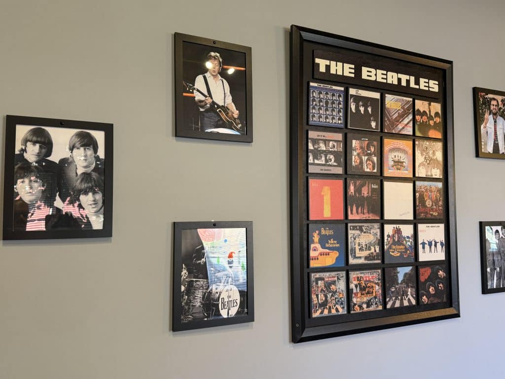 Beatles art and posters on a wall