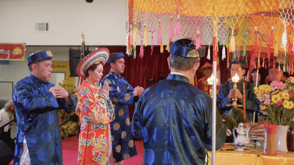 Men and women in traditional Vietnamese clothing at a cultural festival