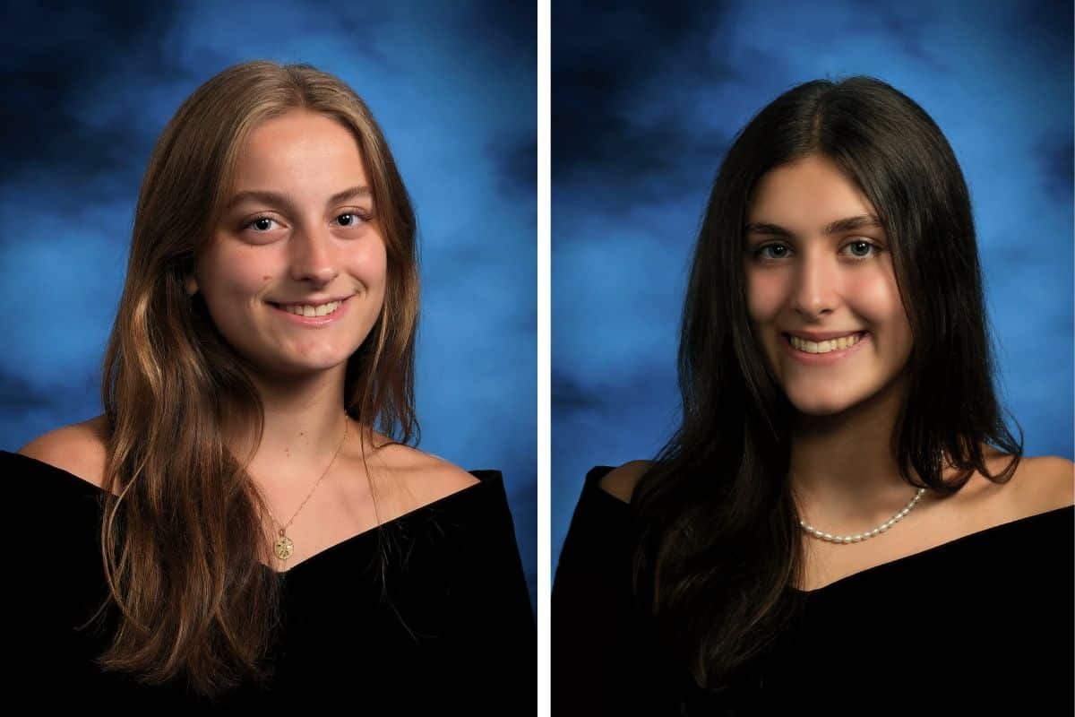 Senior photos of two female Norcross High School students. The one on the left has long blonde hair, parted in the middle. The one on the right has long black hair, parted in the middle. Both are wearing black, off-the-shoulder tops and have blue backgrounds behind them.